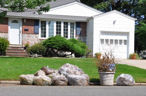 Skip truck delivering waste container to a Waterloo property